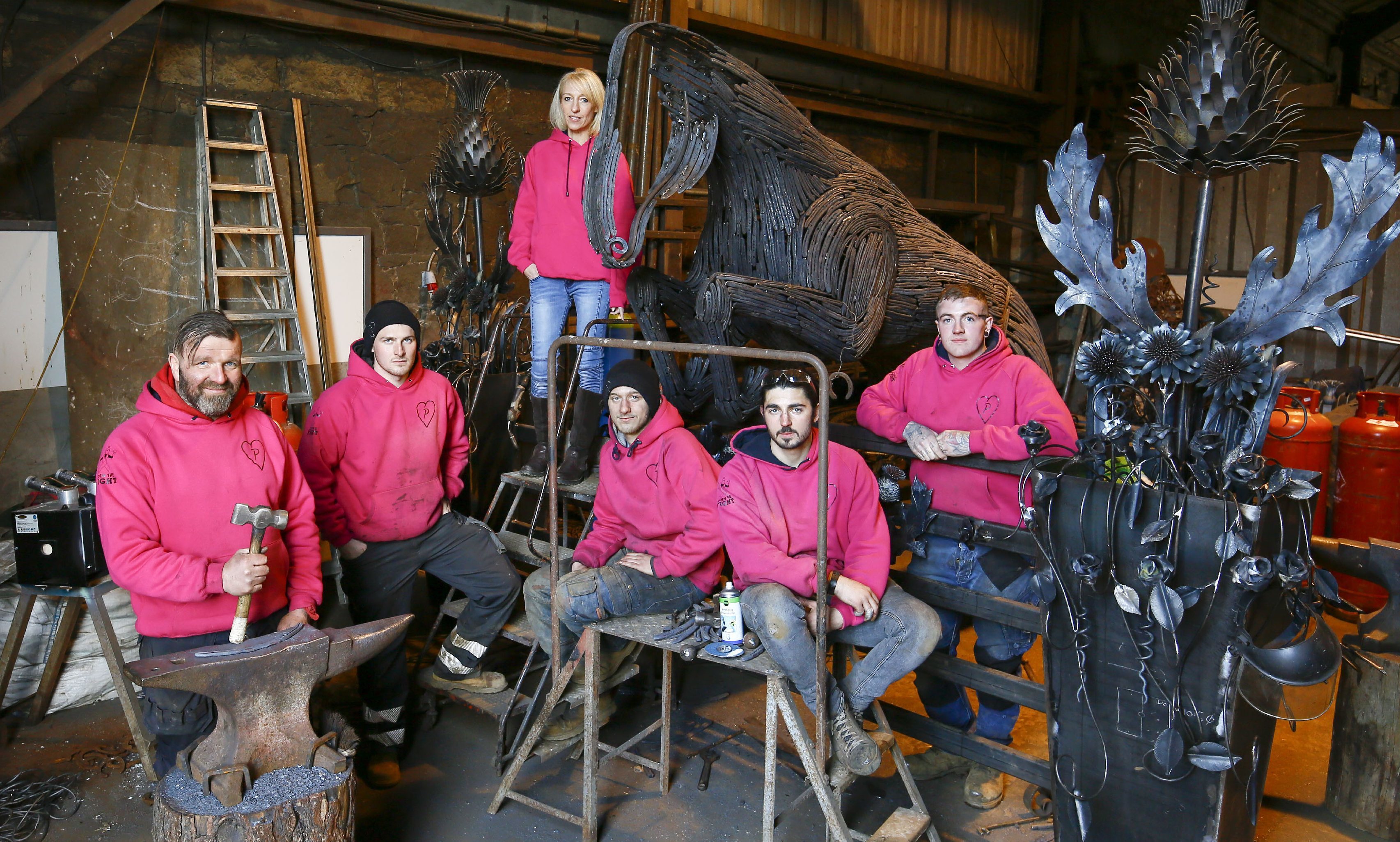 Blacksmith Kevin Paxton and his team within the forge at Ransfield farm