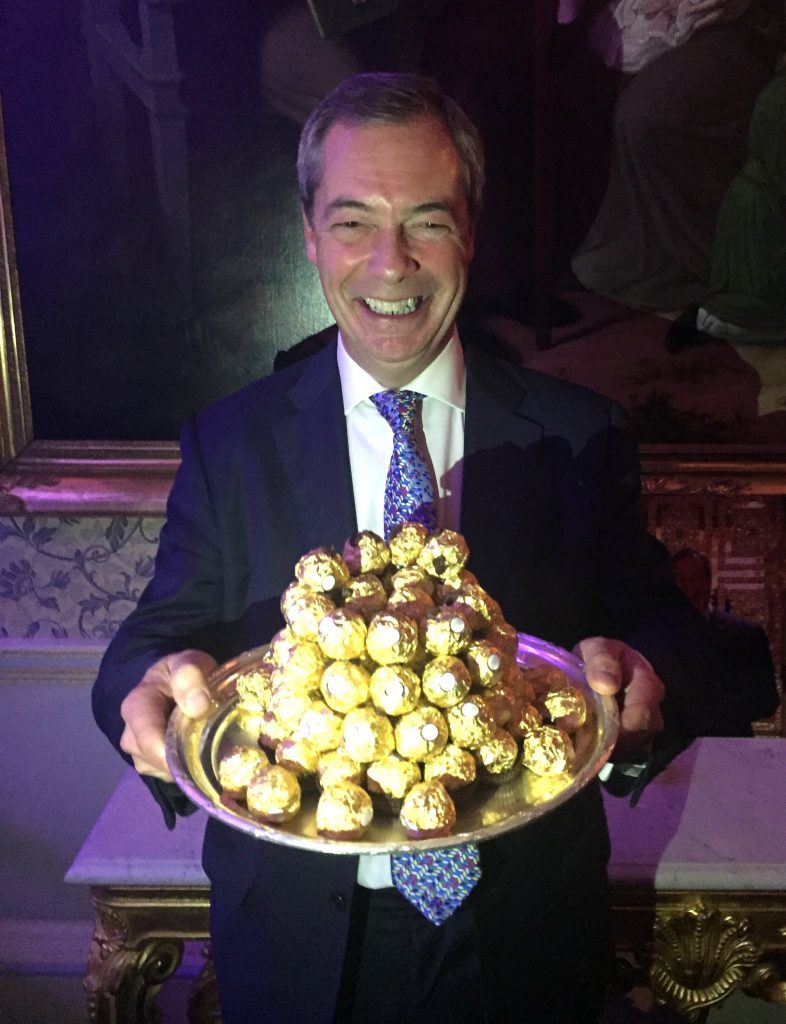 Nigel Farage is presented with a tray of Ferrero Rocher chocolates at an event to thank him for his contribution to Brexit, at The Ritz, London. 