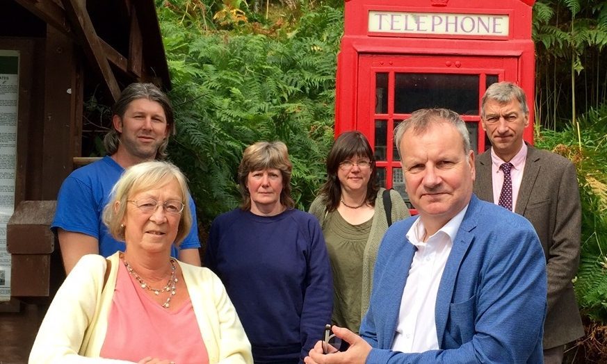 Joe Thompson, June Riddell, Wendy Kirk, Jeanie Grant, Pete and Mike Williamson, with Pete Wishart at Bridge of Balgie telephone box - one of the 84 in Perth and Kinross under threat.