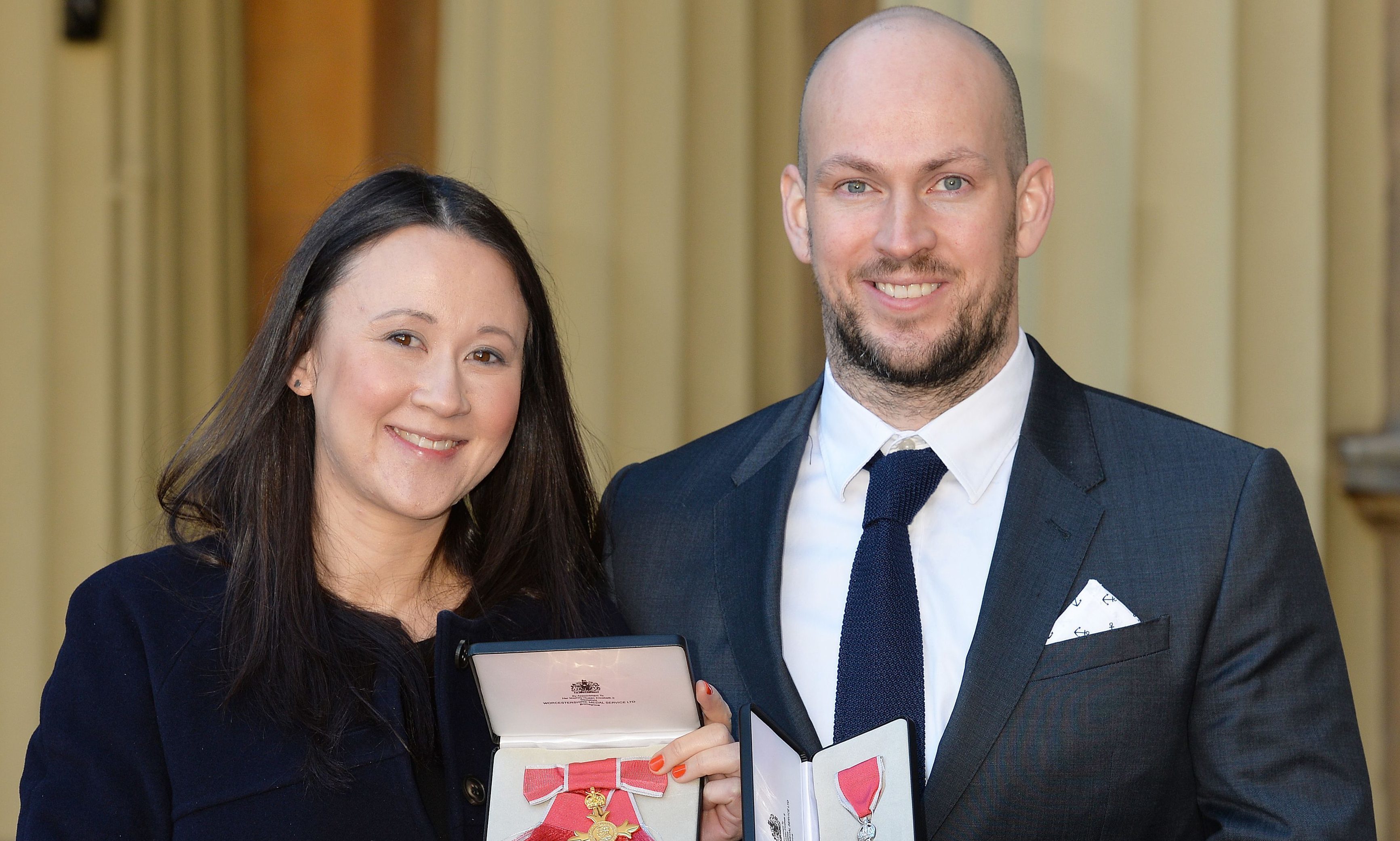 Johanna Basford with her OBE and husband James Watt with his MBE which they received from the Duke of Cambridge during an investiture ceremony at Buckingham Place in 2016.