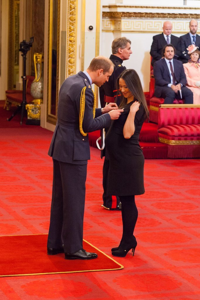 Johanna Basford is made an OBE (Officer of the Order of the British Empire) by the Duke of Cambridge.