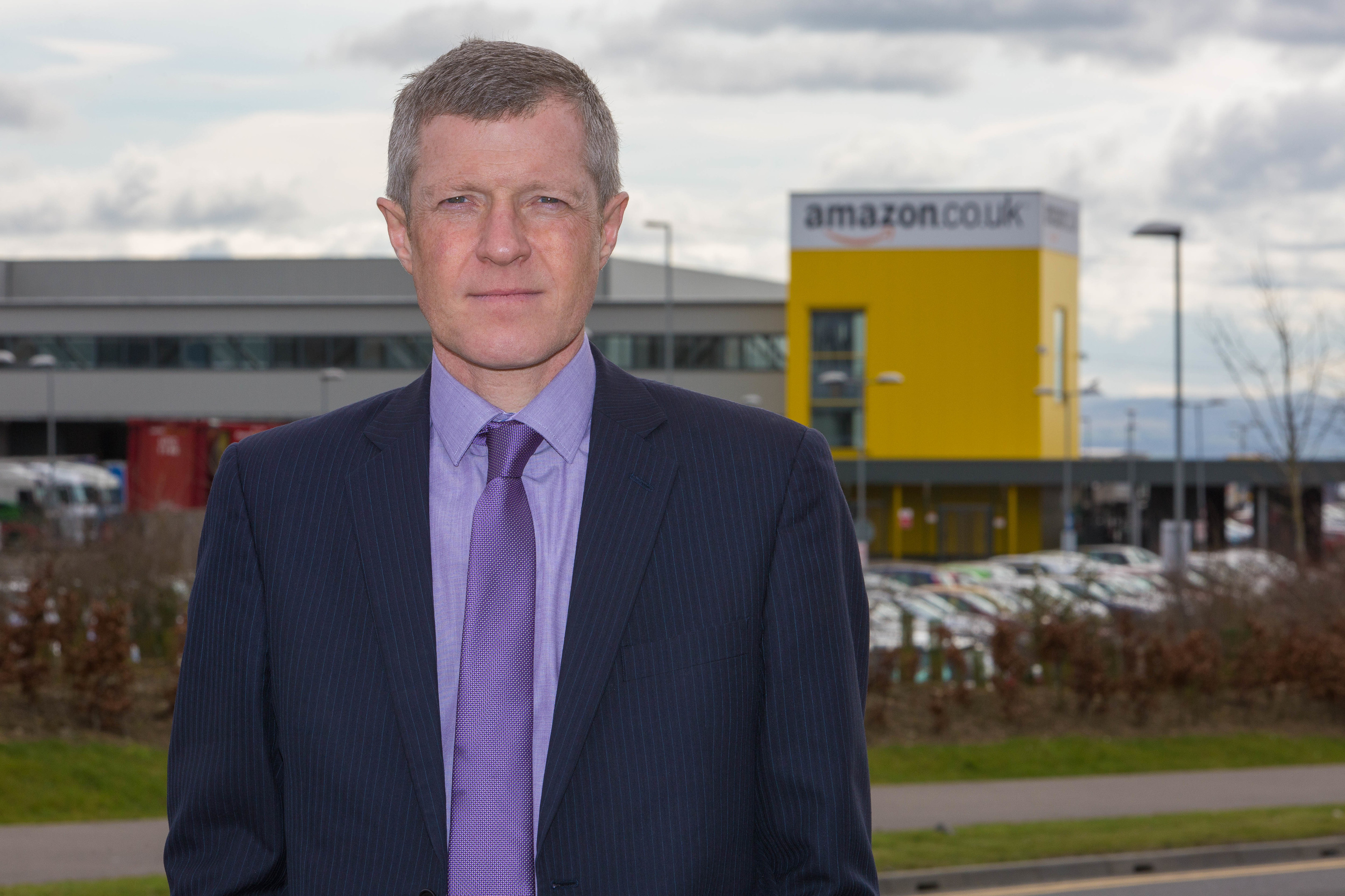 MSP Willie Rennie outside Amazon in Dunfermline.