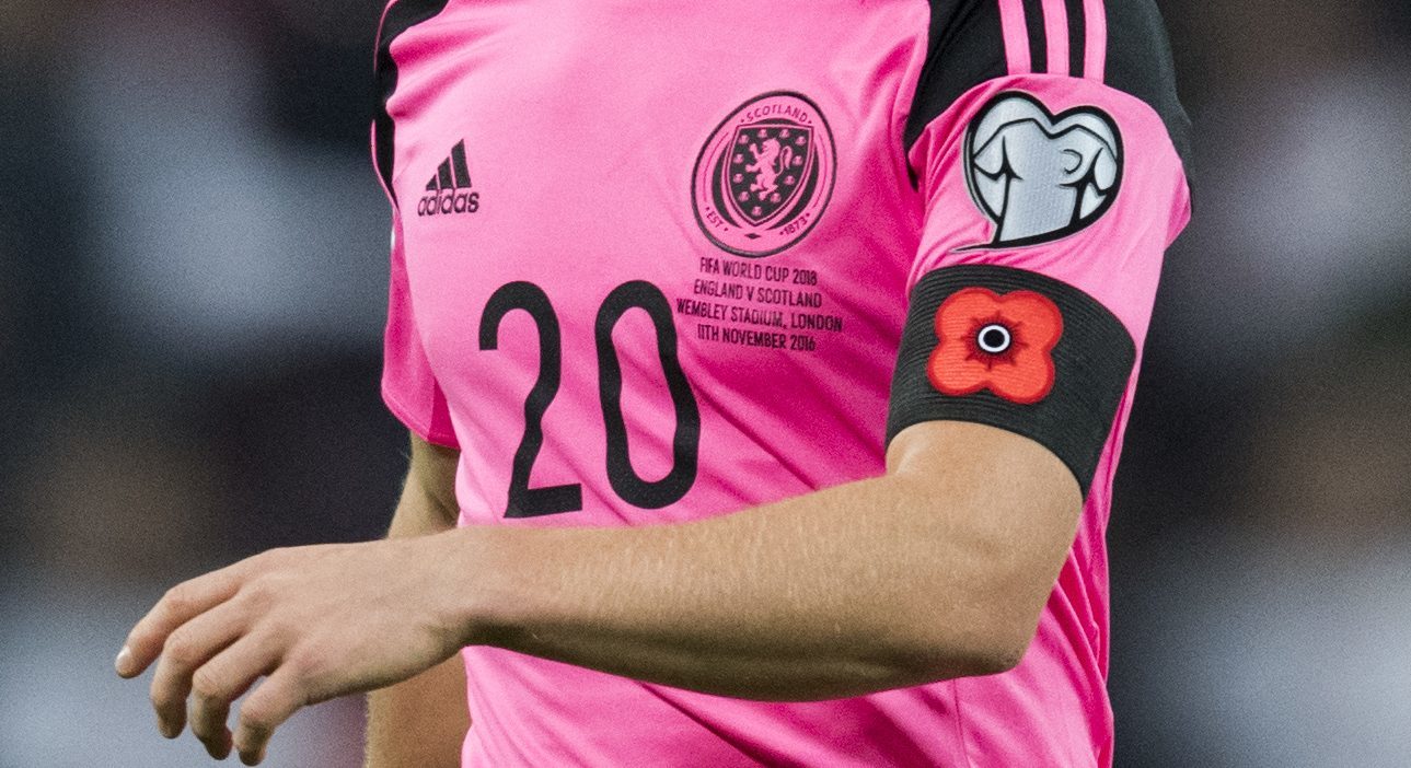 Scotland players joined England in wearing poppies on their armbands during the match.