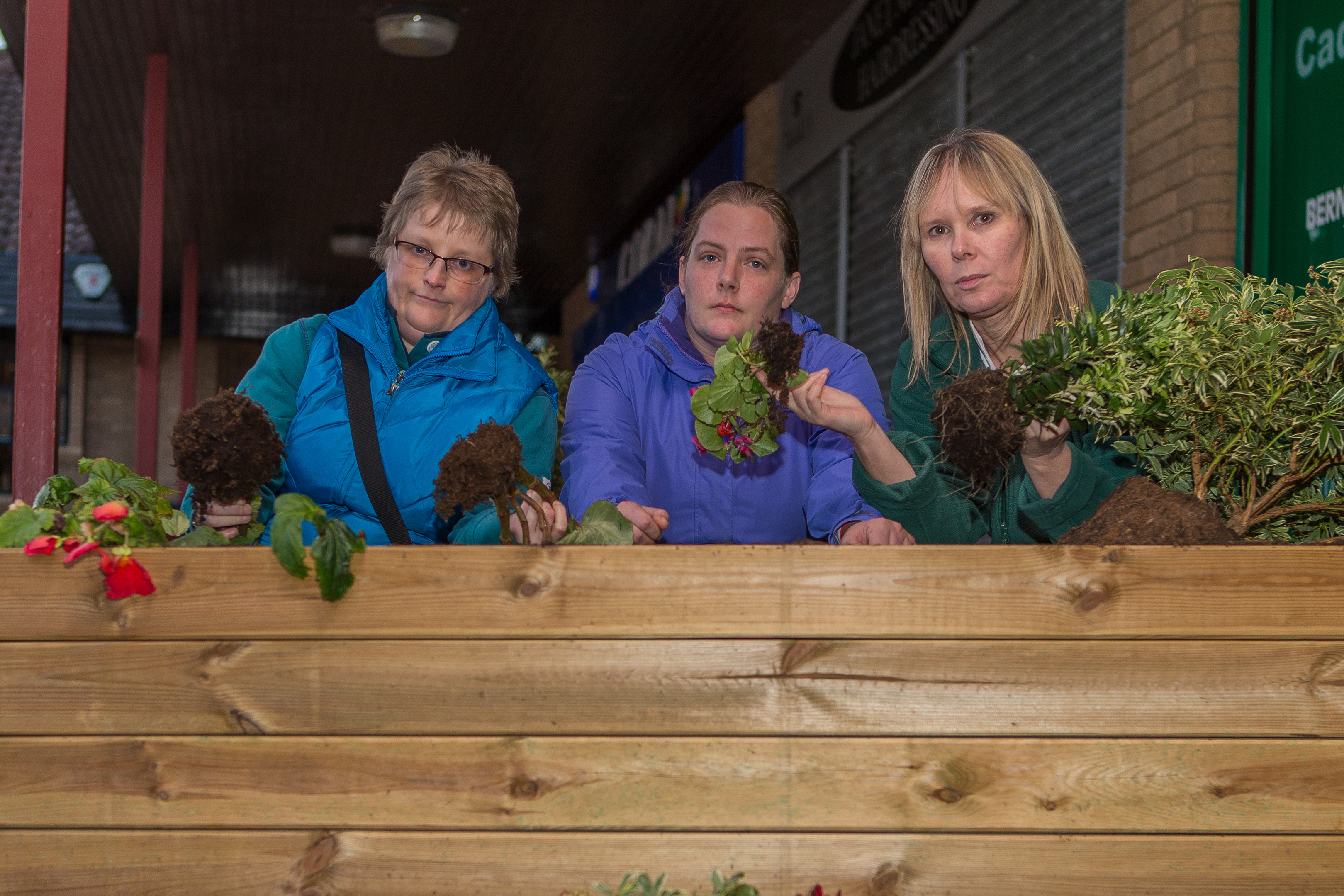 Denise Wallace from the community council (left), Logan's mum Sionaid and Bernadette survey the damage