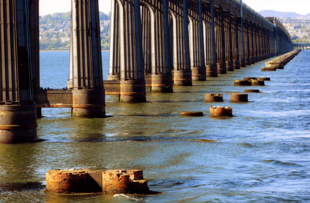 The stumps of the original railway bridge are reminders of the Tay Bridge disaster.