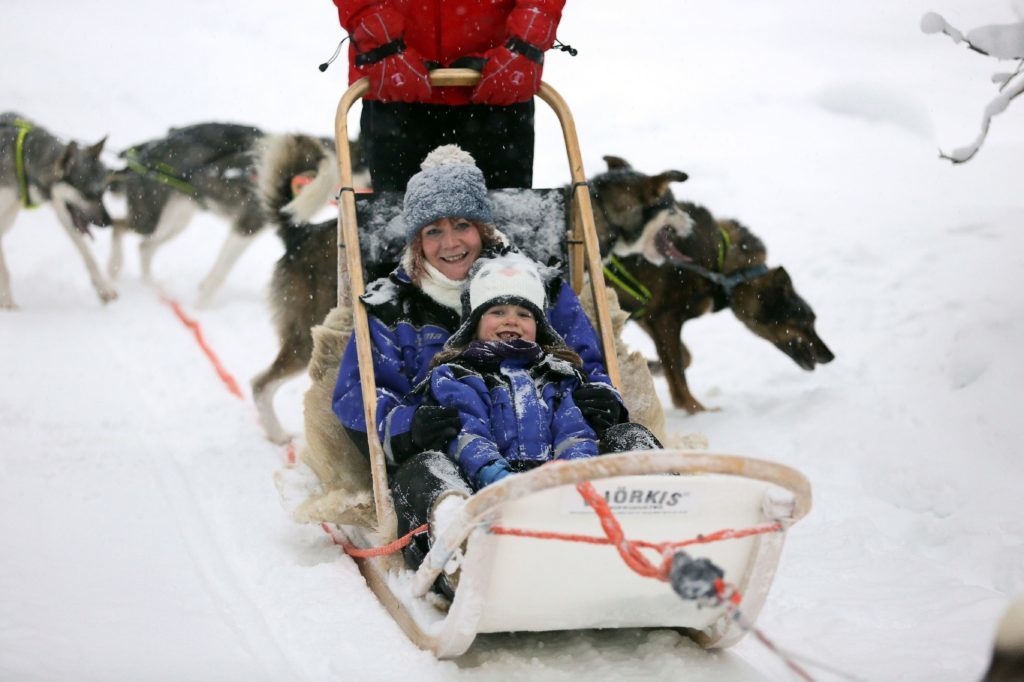 Claire Spreadbury and daughter Rosie on a husky ride. 