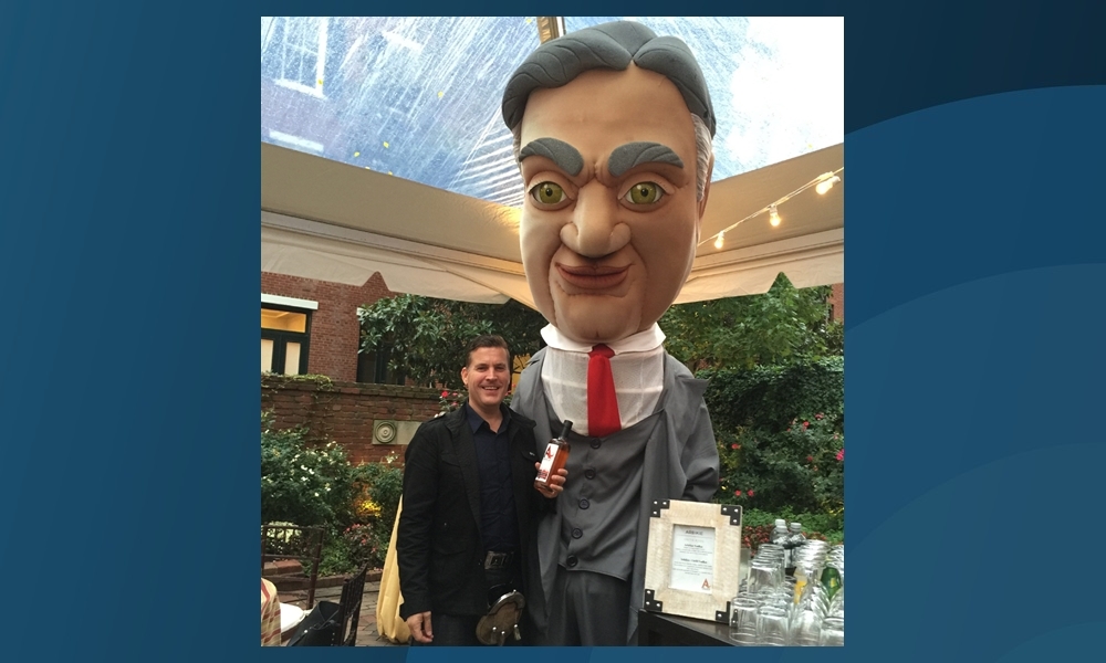 David Stirling with a caricature of Herbert Hoover at the Washington event.