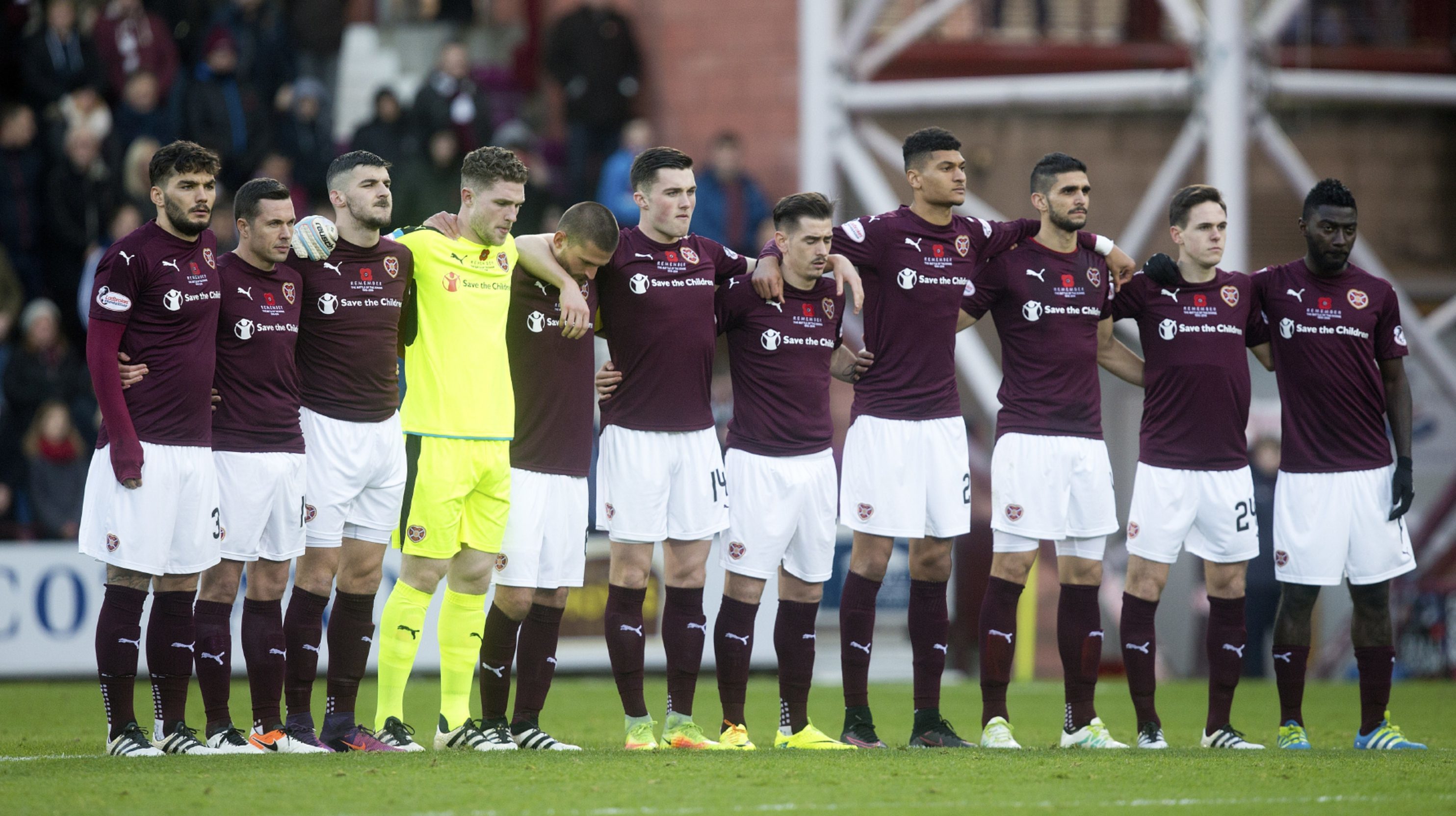 The Hearts players make their silent tribute.