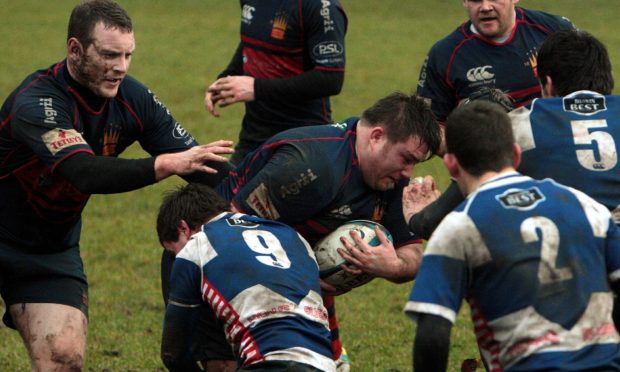 Neil Dymock during his playing days for Dundee High.