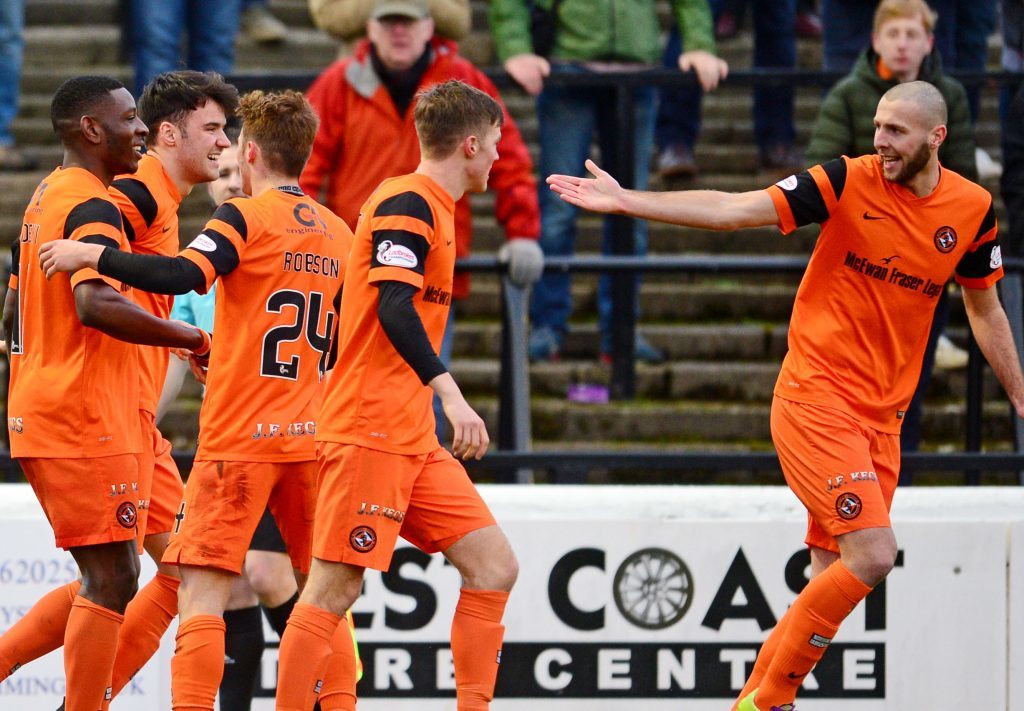 Dundee United celebrate their winning goal at Ayr.