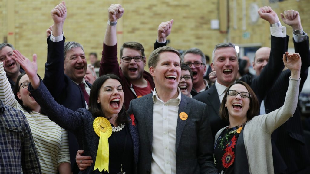 The Lib Dems celebrate.
