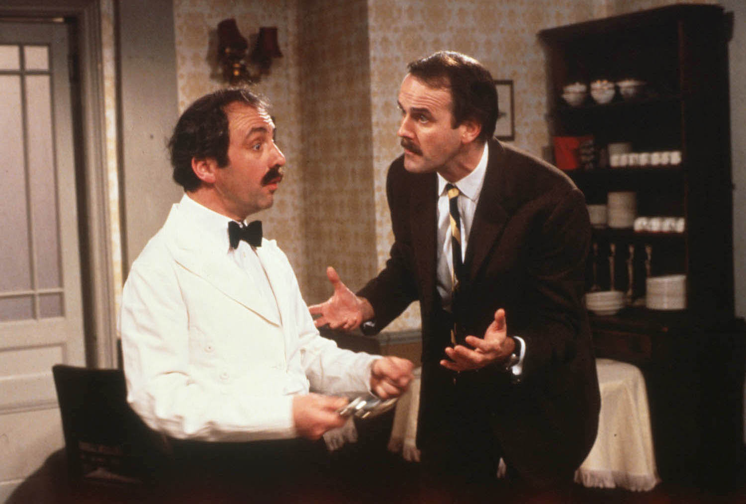 Andrew Sachs as Manuel, left, and John Cleese as Basil in BBC's Fawlty Towers.