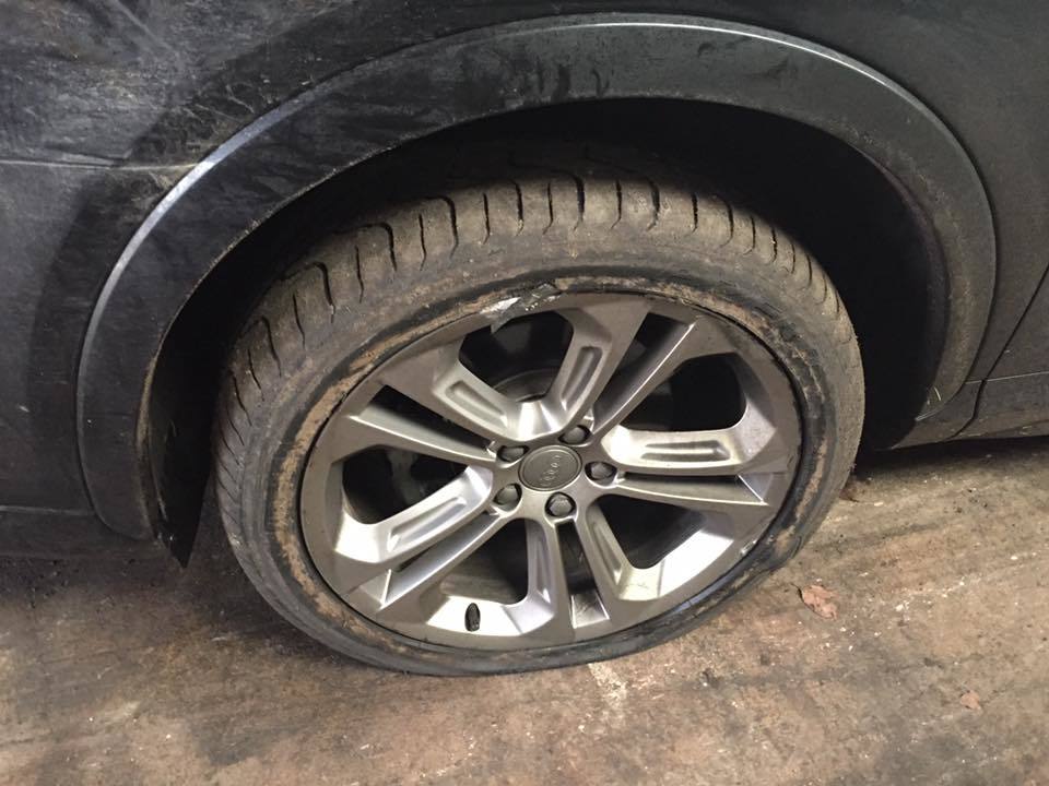 A battered alloy on the Audi