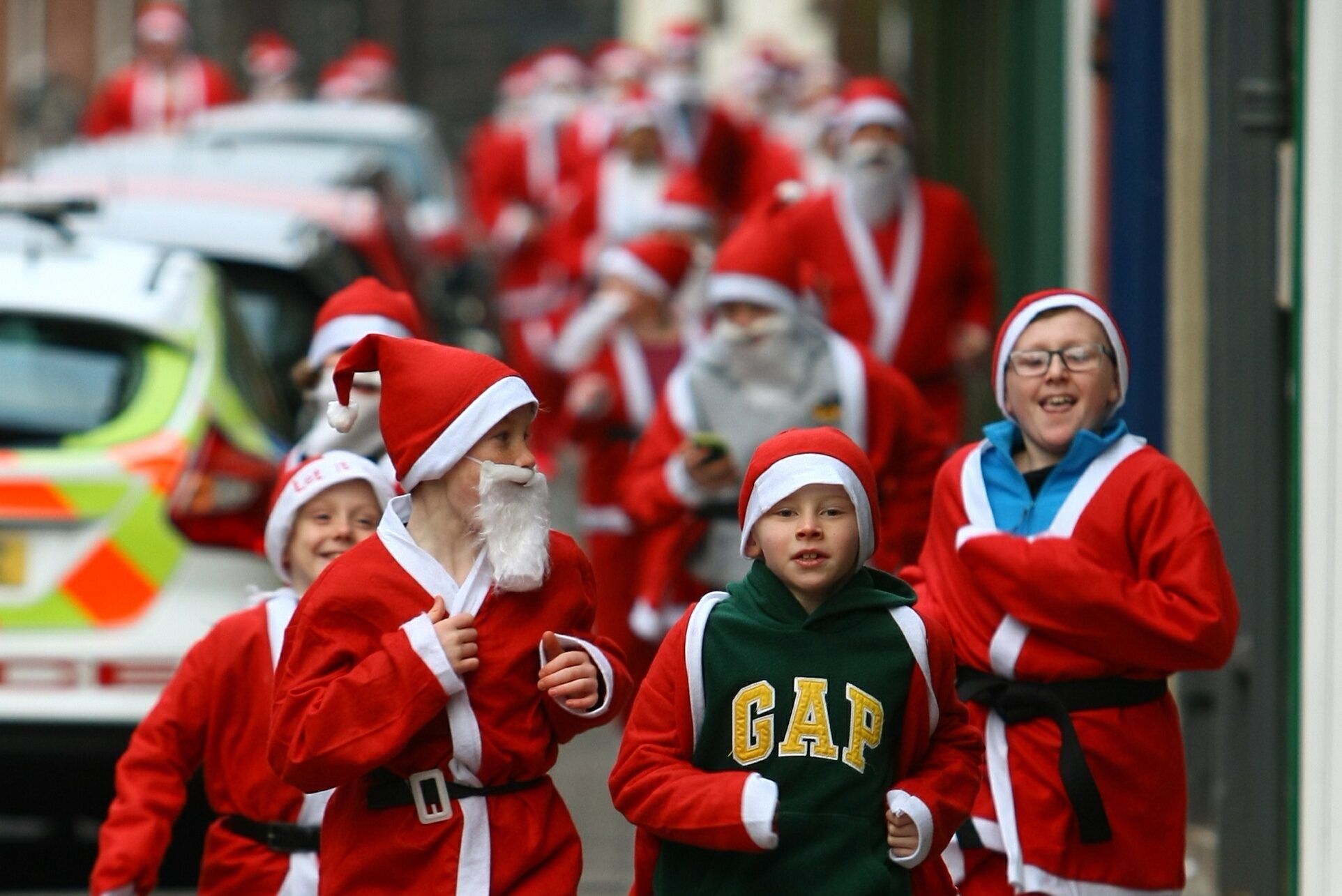 The Santa vanguard pounds its way down the High Street
