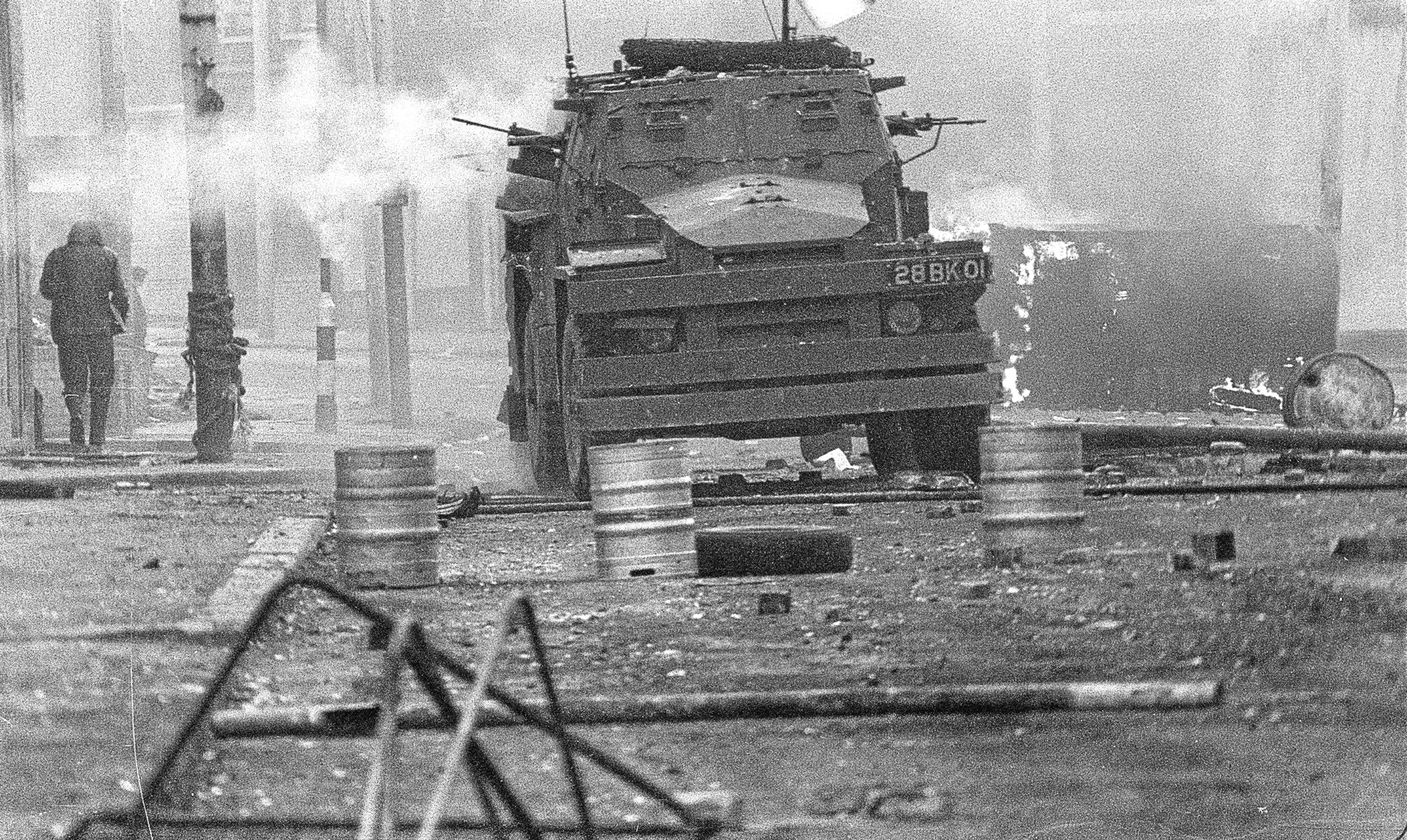 An armoured vehicle patrols Belfast following the shooting of Joe McCann.