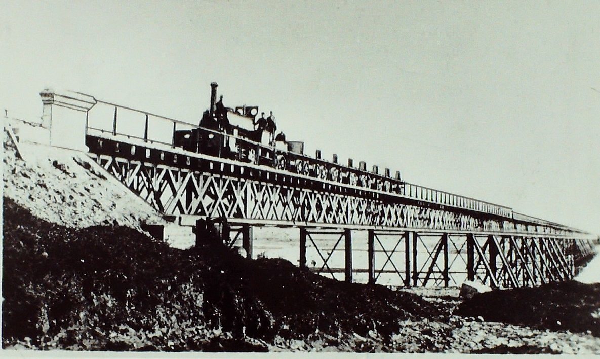 The first train on the Arbroath-Montrose line crossing the bridge at Montrose in 1883.