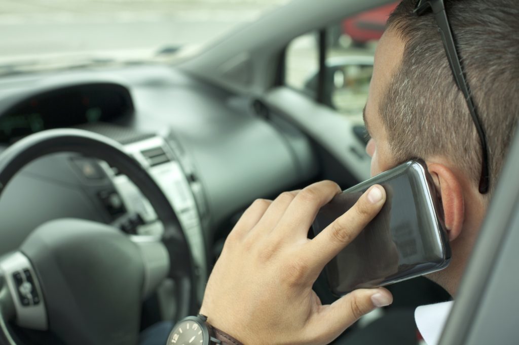 Drivers using contactless technology on their smart phones in drive through restaurants could risk a fine.