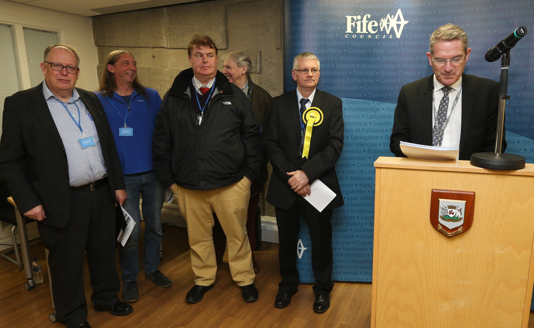 Returning officer Steve Grimmond (right) announces Alistair Suttie (second right) the winner