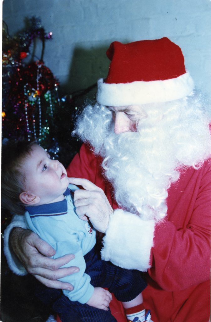 Santa at the Post Office. Liam Saunders and Santa at the Post Office, Dundee East in 1991. 