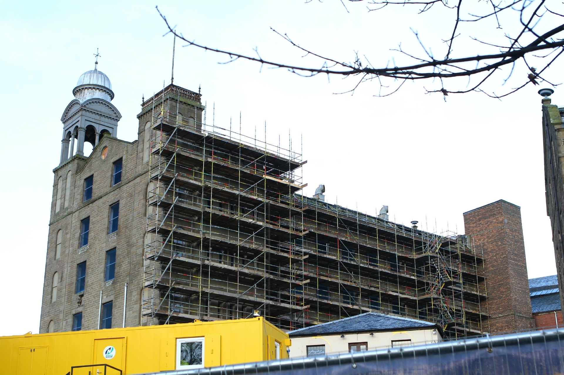 The Lower Dens Works has scaffolding erected in readiness for the start of work to convert it into an Indigo hotel.