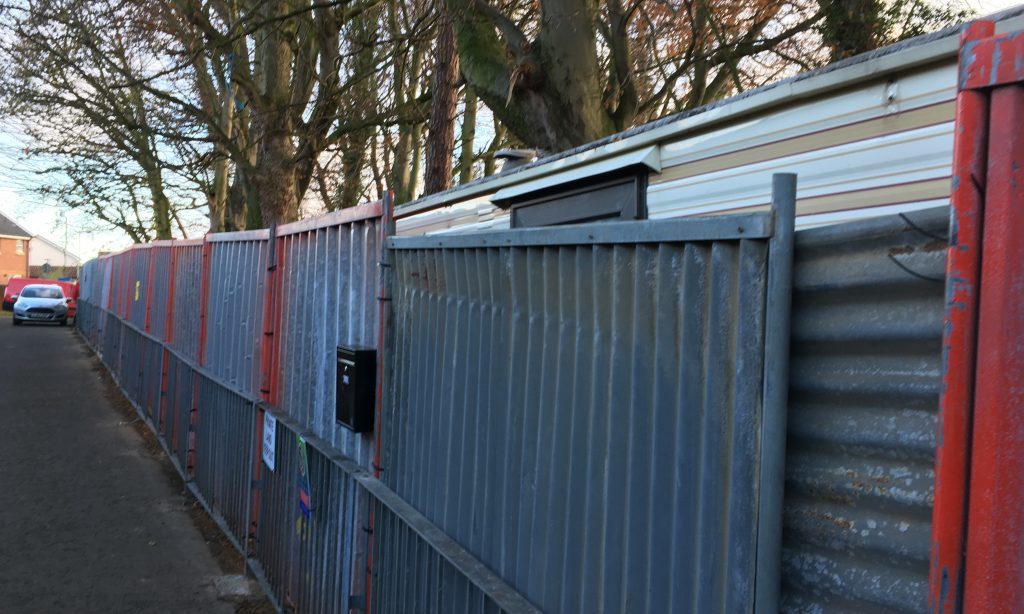 Fencing surrounding the caravan on land at North Balmossie Street.