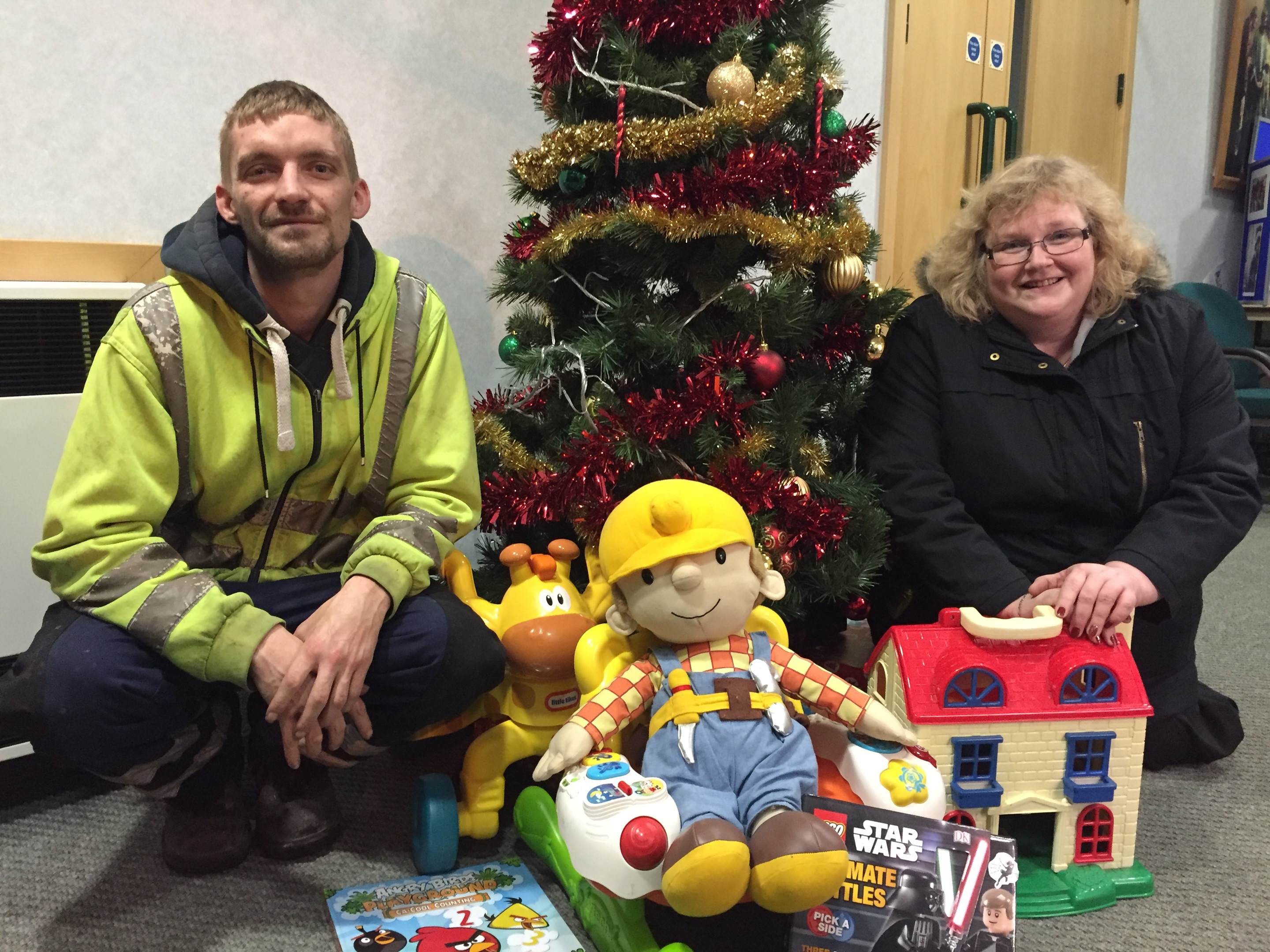 Page member Dave Elliott with Tracy Johnstone and some of the donated toys.
