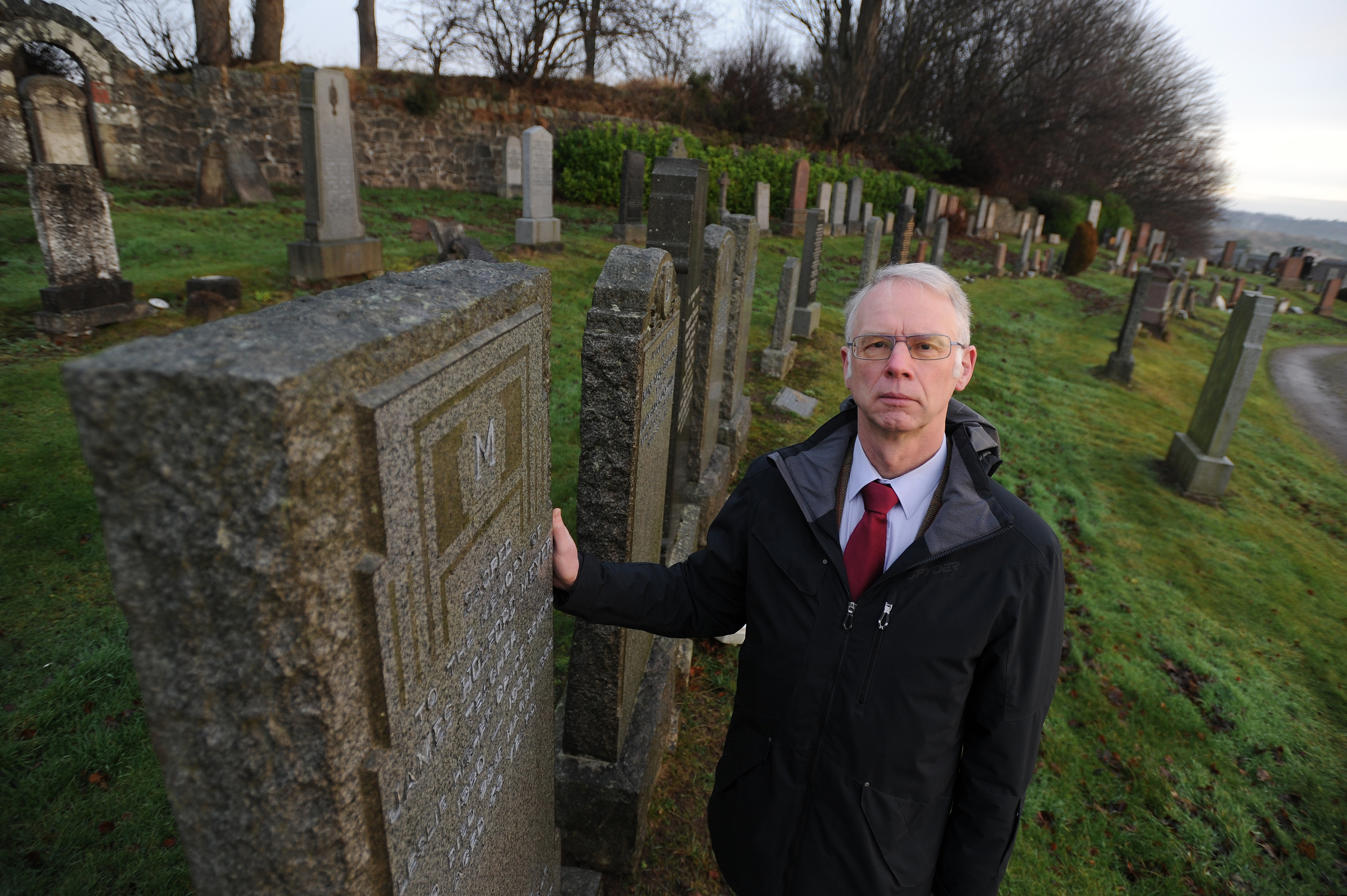 Councillor John Wincott looks around Leslie Cemetery.