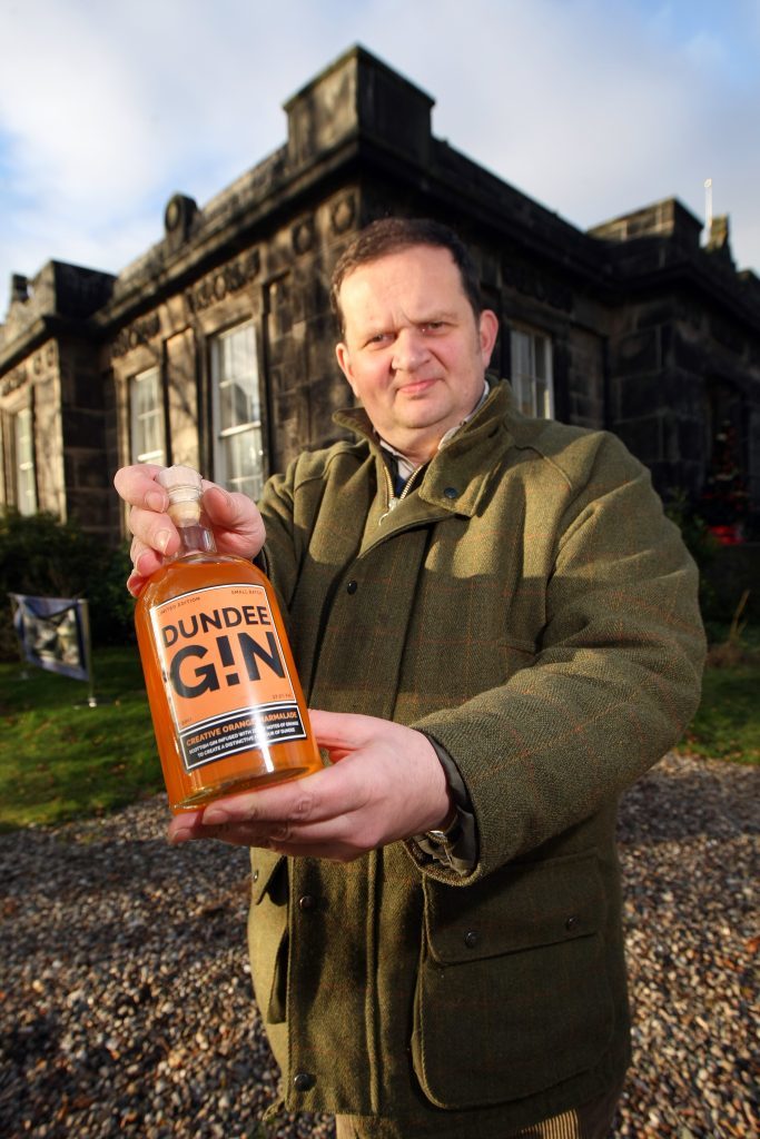 Peter Menzies with his marmalade-inspired Dundee Gin.