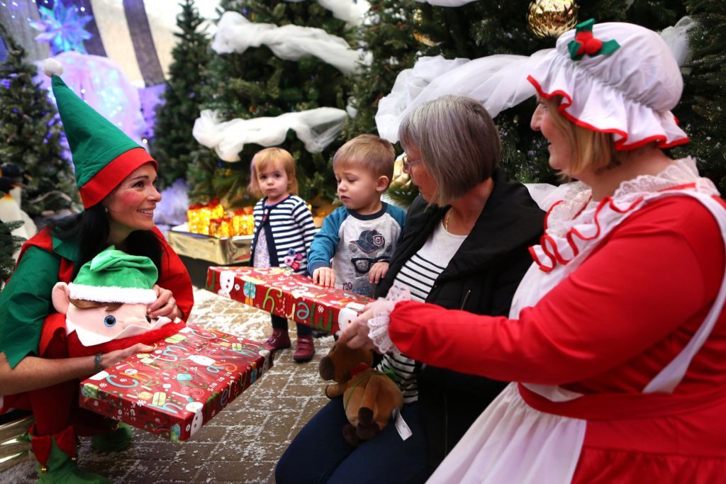 Gayle (the elf) with Poppy and Finn Killen and grandmother Jennifer Hall. 