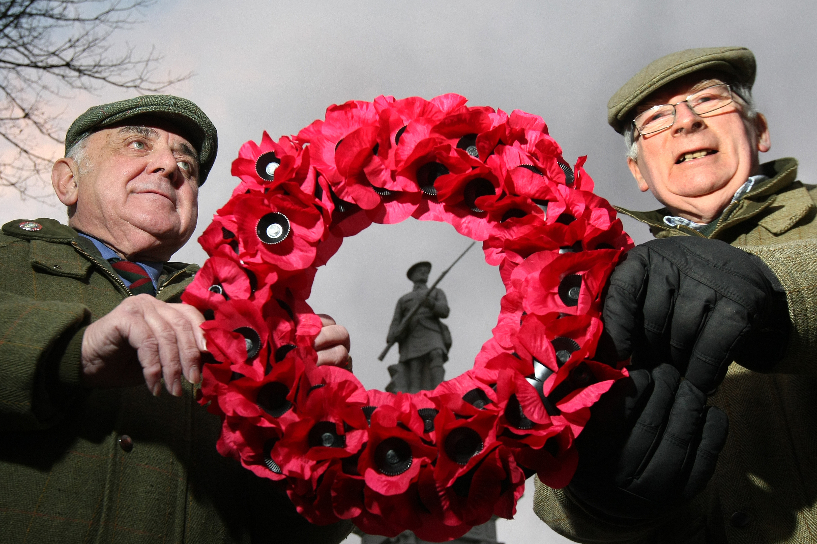 Cllr Ronnie Proctor and Jim Ritchie with a wreath at the Kirriemuir war memorial in previous years.