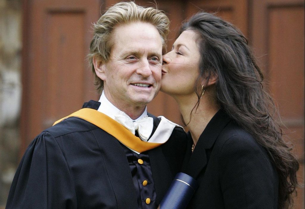 Kirk Douglas' son - Hollywood star Michael Douglas - receives a kiss from wife Catherine Zeta Jones after collecting his honorary degree at Younger Hall in St Andrews in 2006