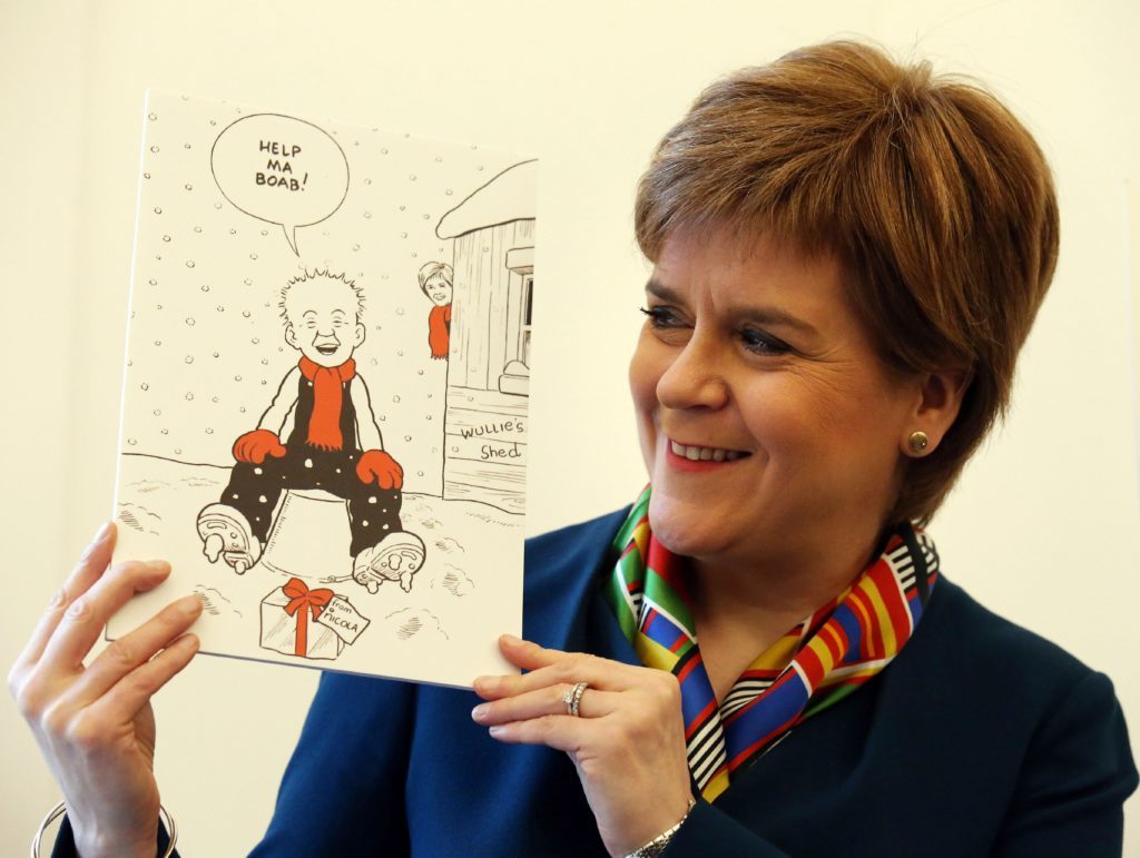 First Minister Nicola Sturgeon unveiling the Oor Wullie Christmas card. 