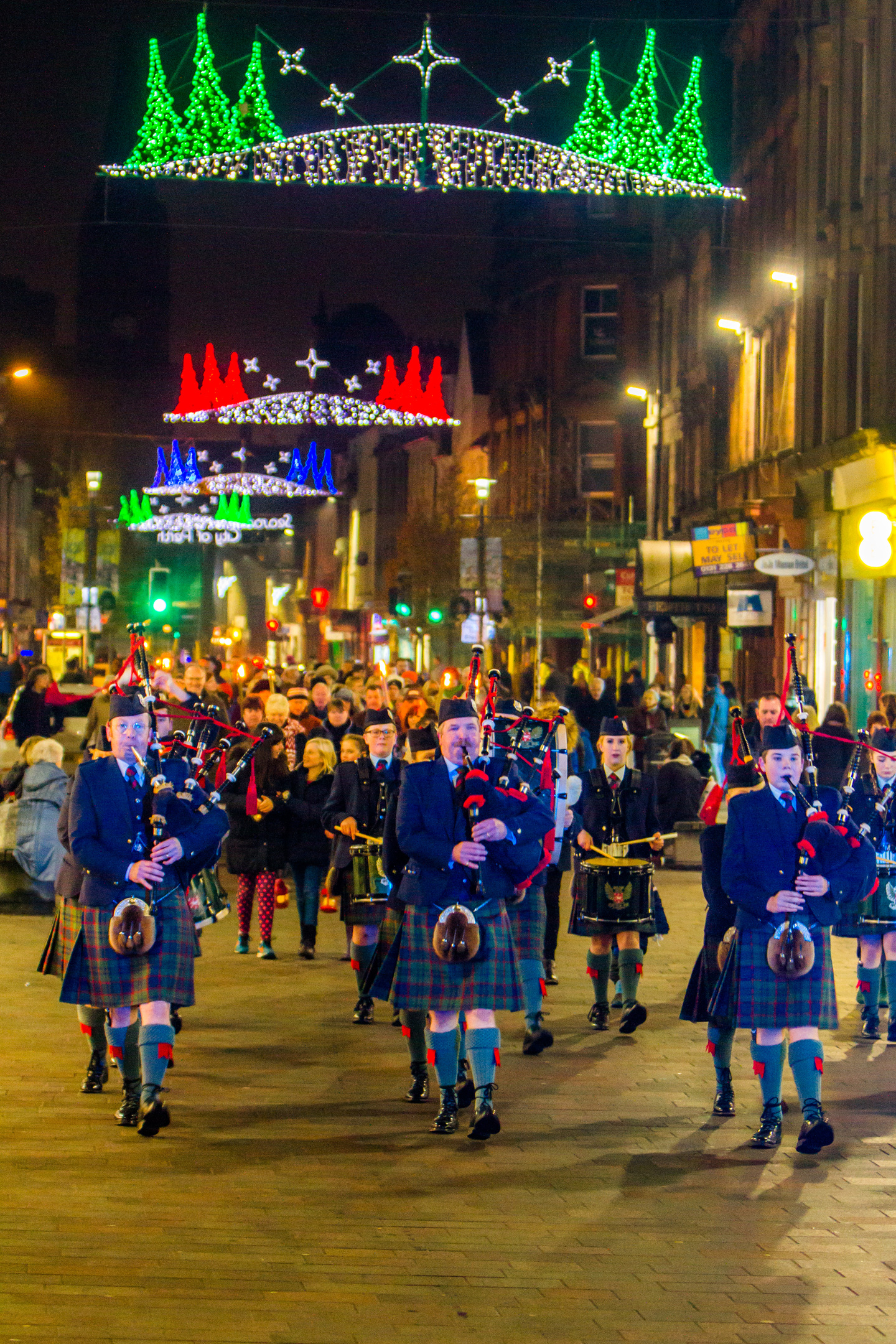 Courier News - Perth - Jamie Buchan Story. Christmas Lantern Parade and Nativity scene. Picture shows the parade moving down the High Street, with Perth & District Pipe Band at the front. High Street, Perth. Saturday 3rd December 2016.