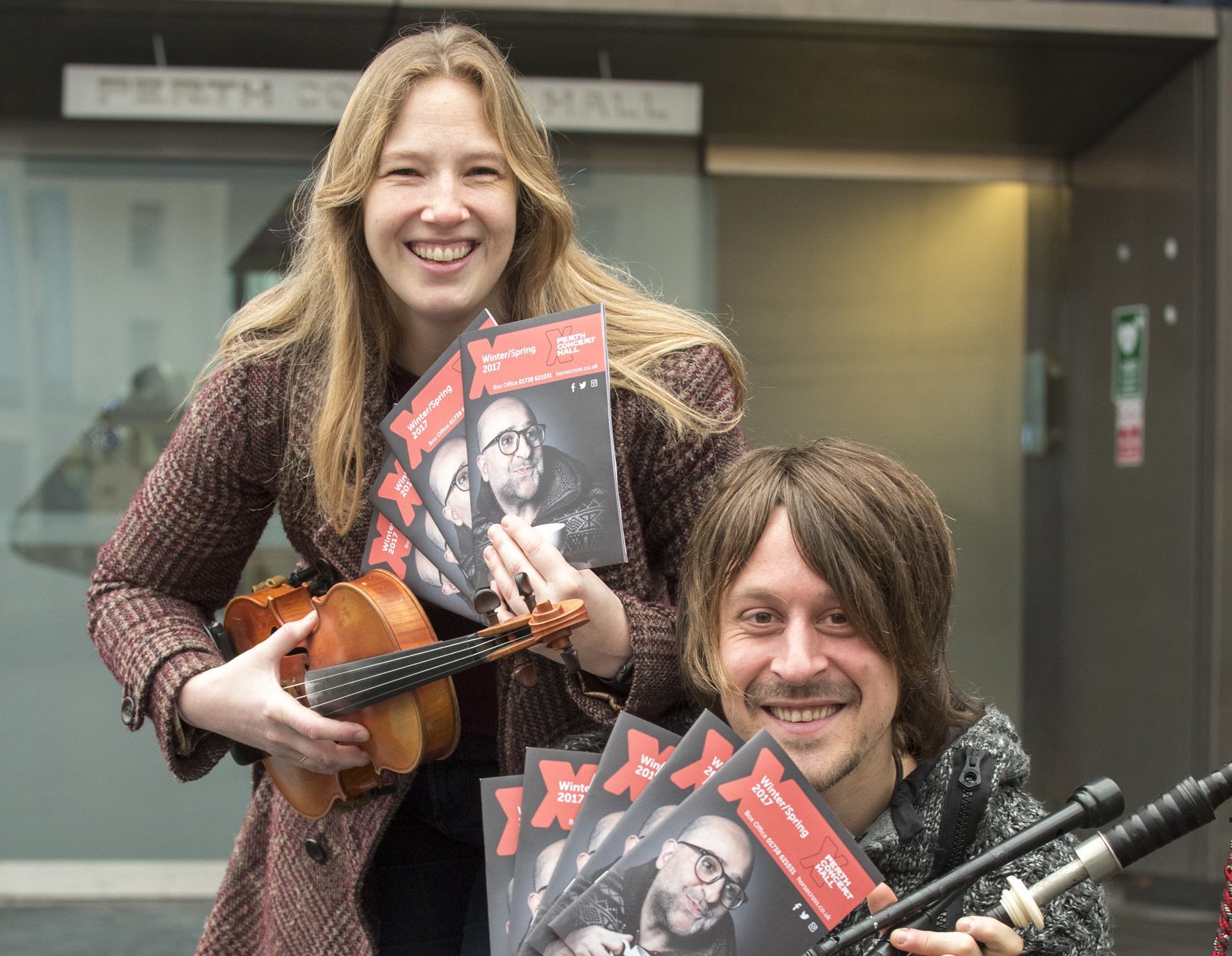 Musicians Ross Ainslie and Patsy Reid pictured with the new brochure outside Perth Concert Hall.
