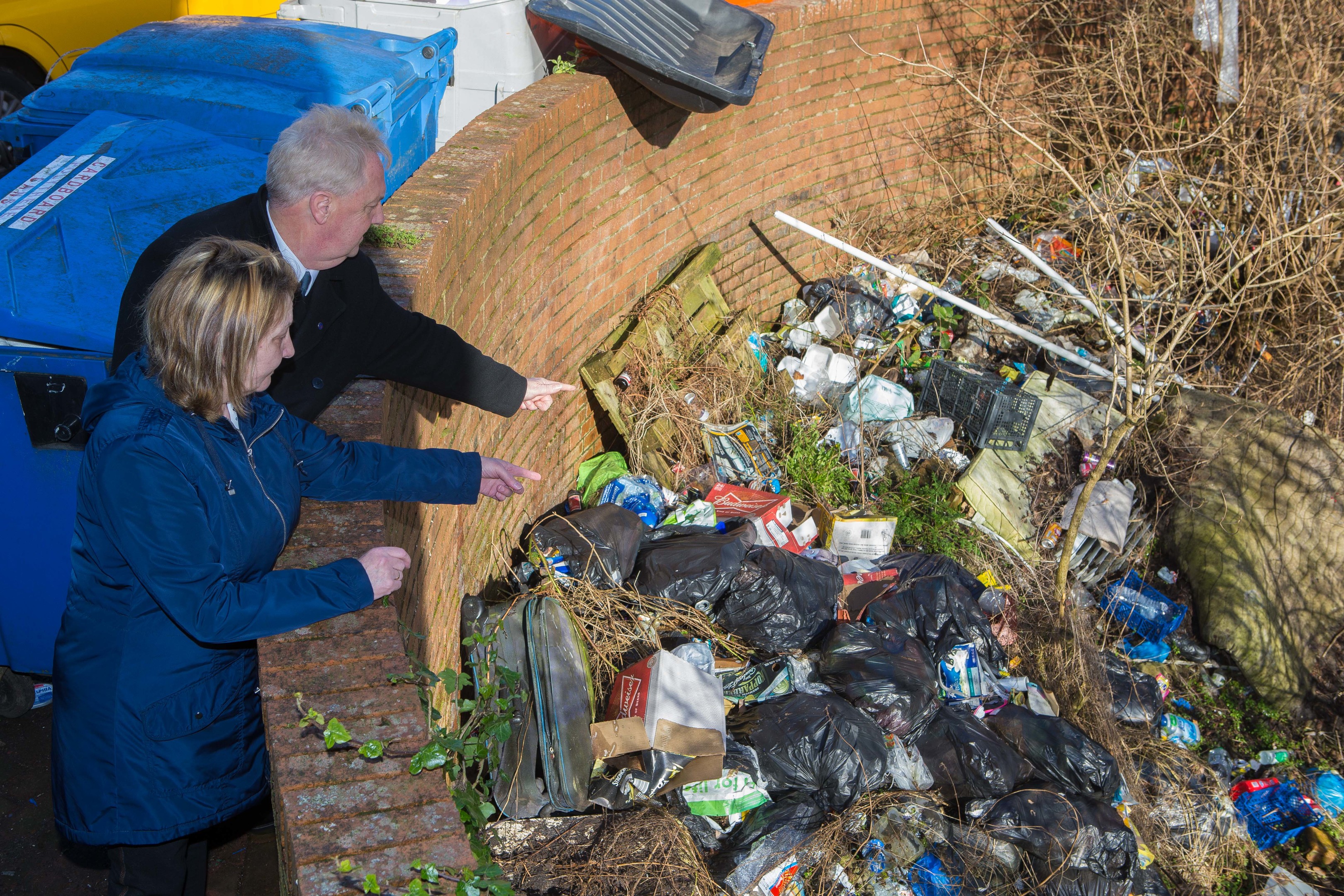 Councillor John O'Brien and local resident Phamie Campbell at the source of the rat infestation which has taken over the block in Wellsley Road, Methil.