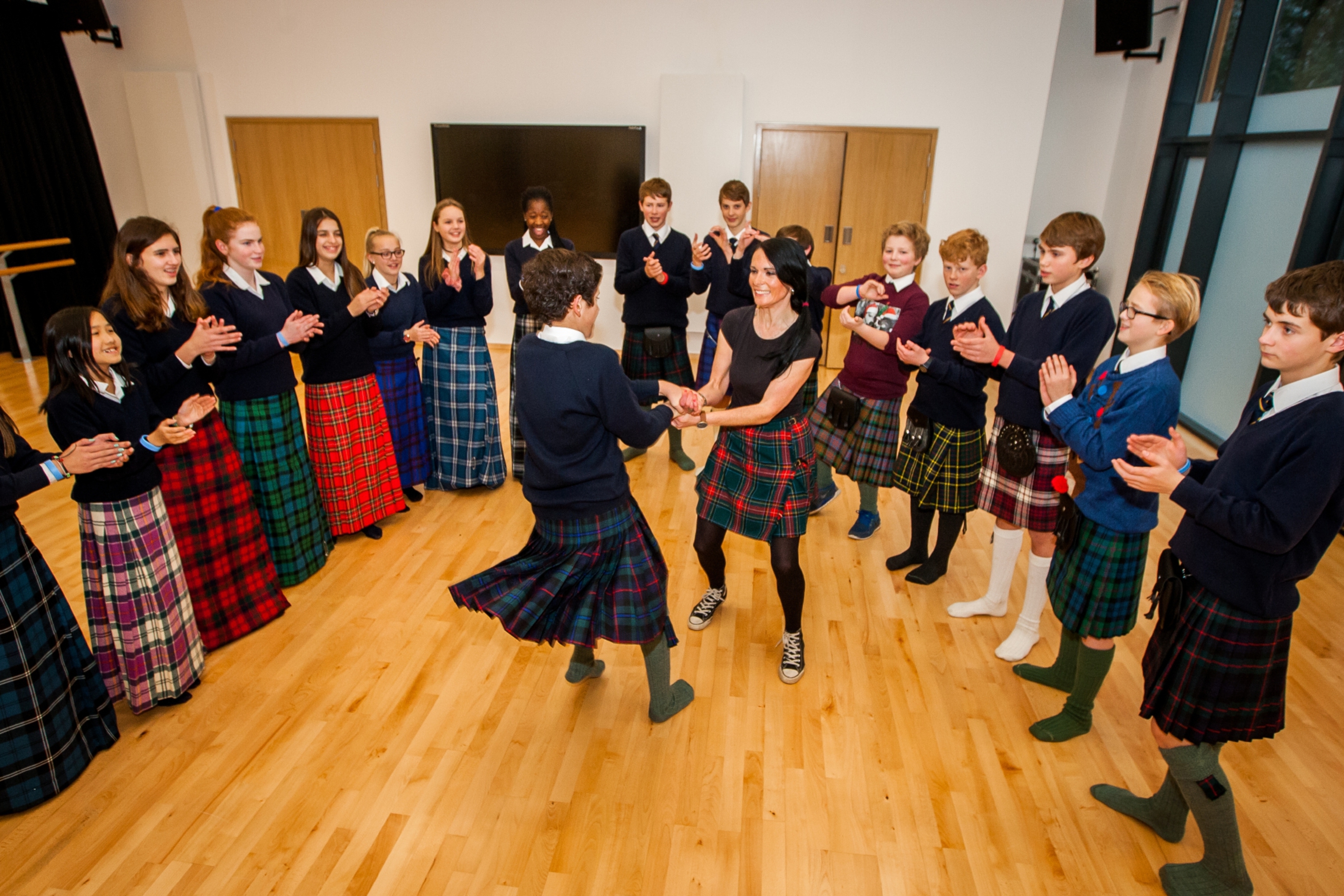 Gayle Ritchie spins with Juan Mianna during a social dancing class at Strathallan School.