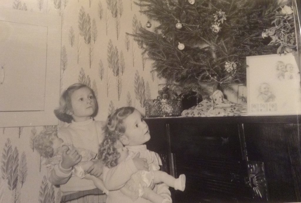 Sue, right, with sister Carol with their Christmas dolls.