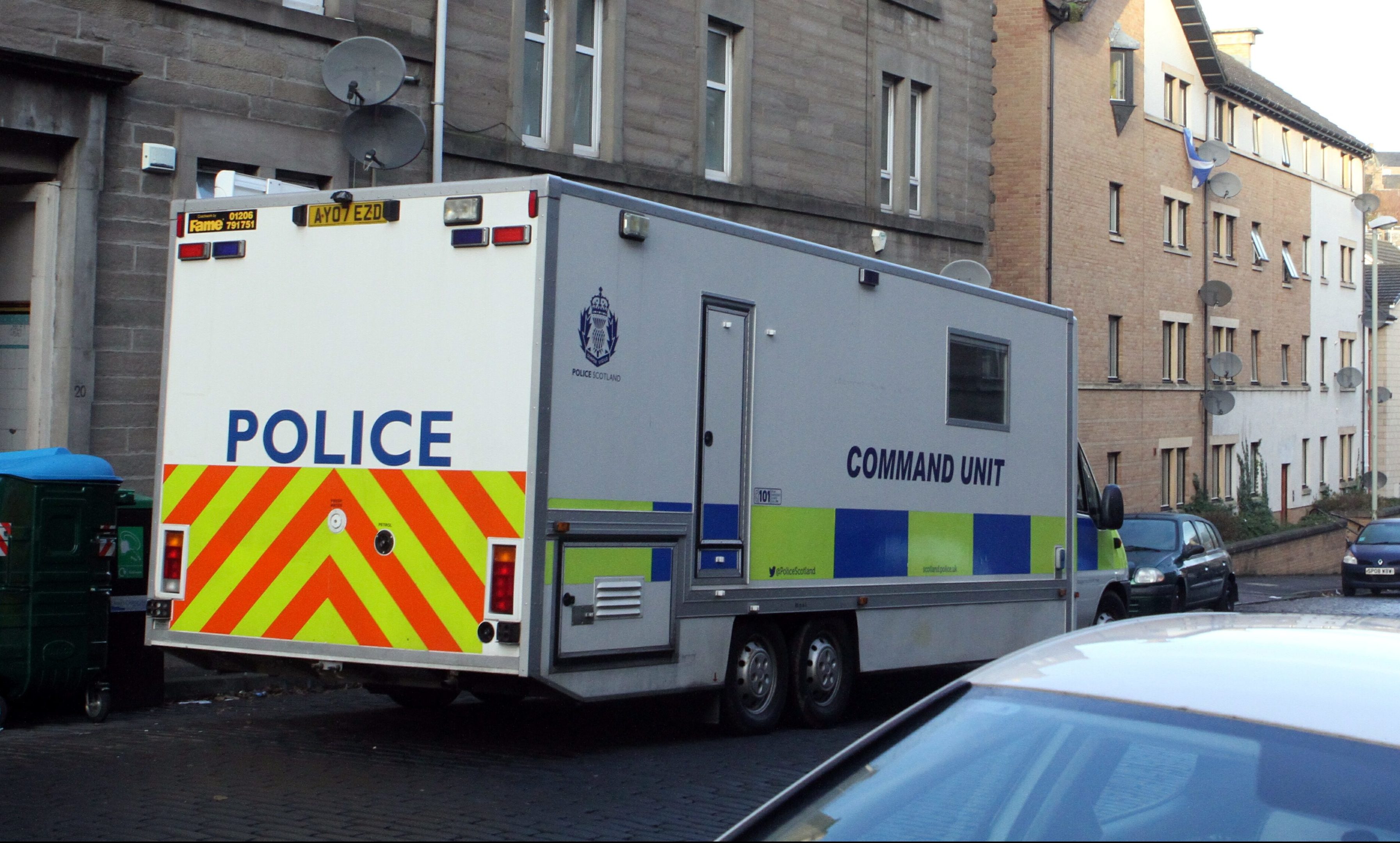 Police on Dundee's Rosefield Street after the discovery of Holly Alexander and Ronnie Kidd's bodies