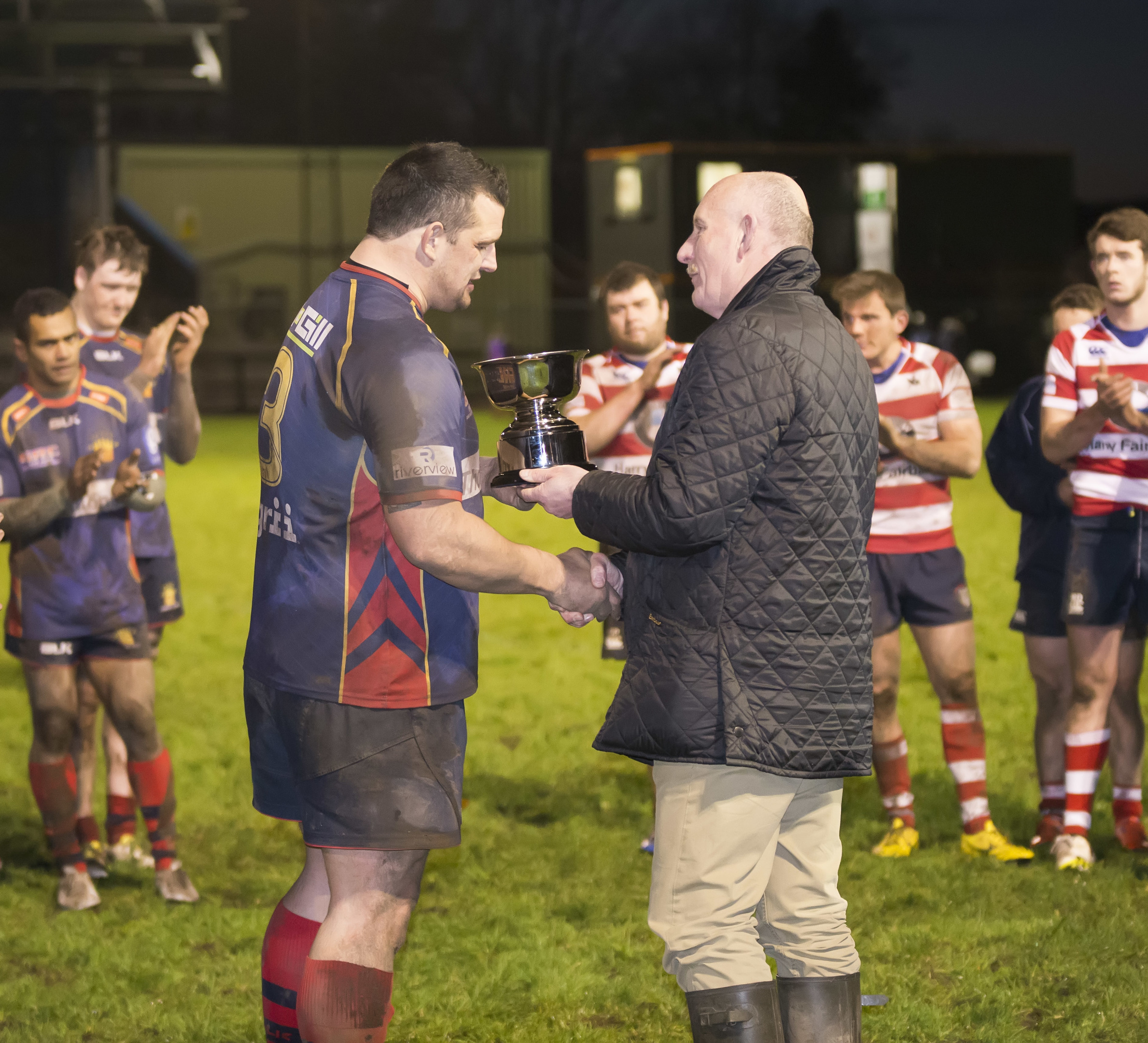 Ian Rankin presents the Rankin Bowl to Dundee HSFP skipper Alan Brown after last year's clash between the teams at Duffus Park.