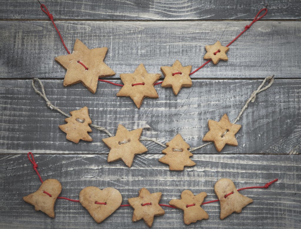 Gingerbreads in christmas shapes on the twine