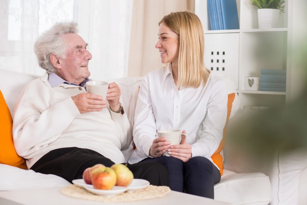 Young volunteer in nursing home