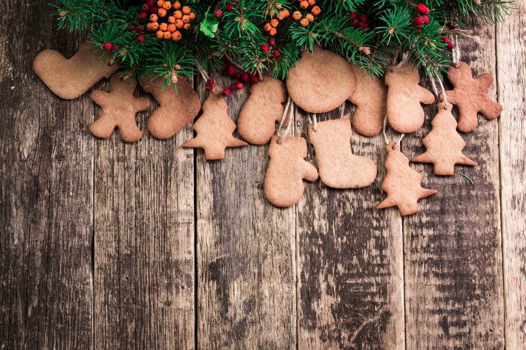 Christmas background with fir tree,Gingerbread Cookies and holiday decor