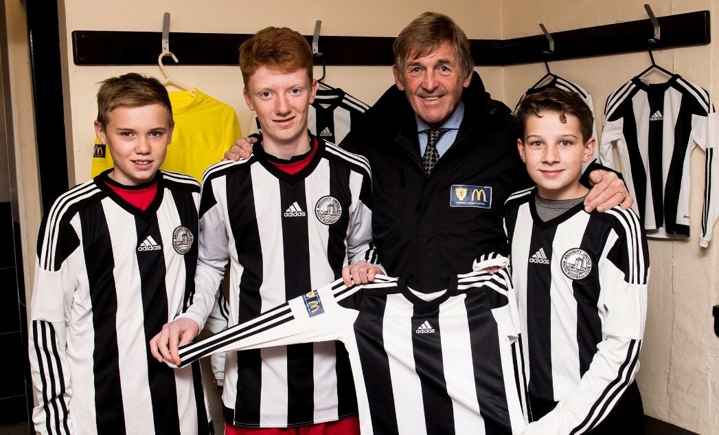 Kenny Dalglish with some of the Broughty United squad.