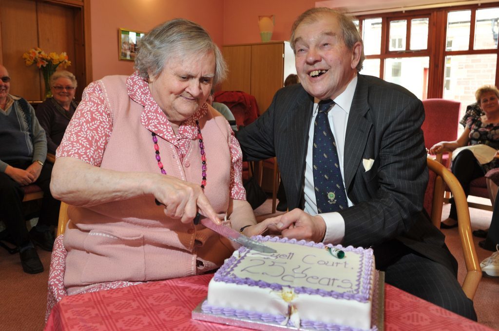 Lord Lyell with resident Annie Robertson at the 25th anniversary of the Lyell Court sheltered housing complex in Kirriemuir in 2012.