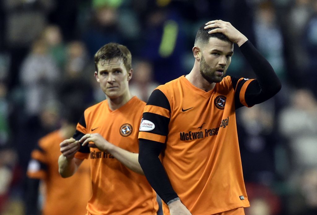 Dejection for Dundee United's Paul Dixon and Scott Fraser at Easter Road.