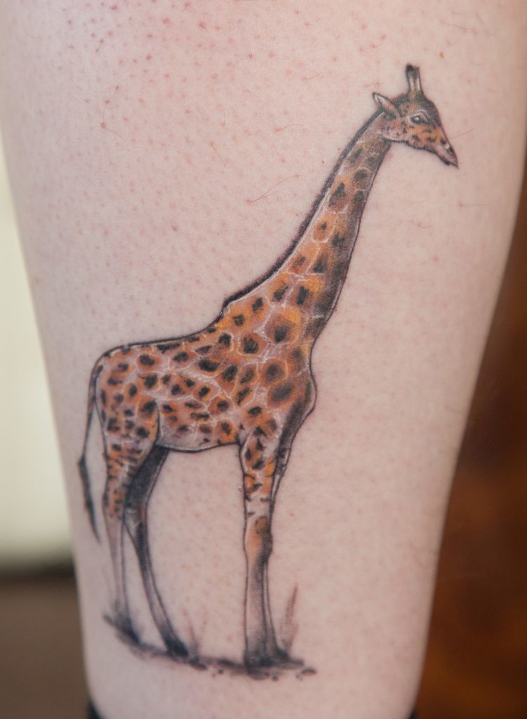 Stuart Scott from Arbroath with tattoo of a giraffe on his leg