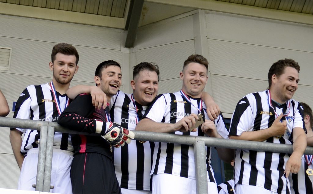 Dunfermline fans team against Falkirk, 2016. Iain Cook, pictured in the middle, celebrates with his teammates.