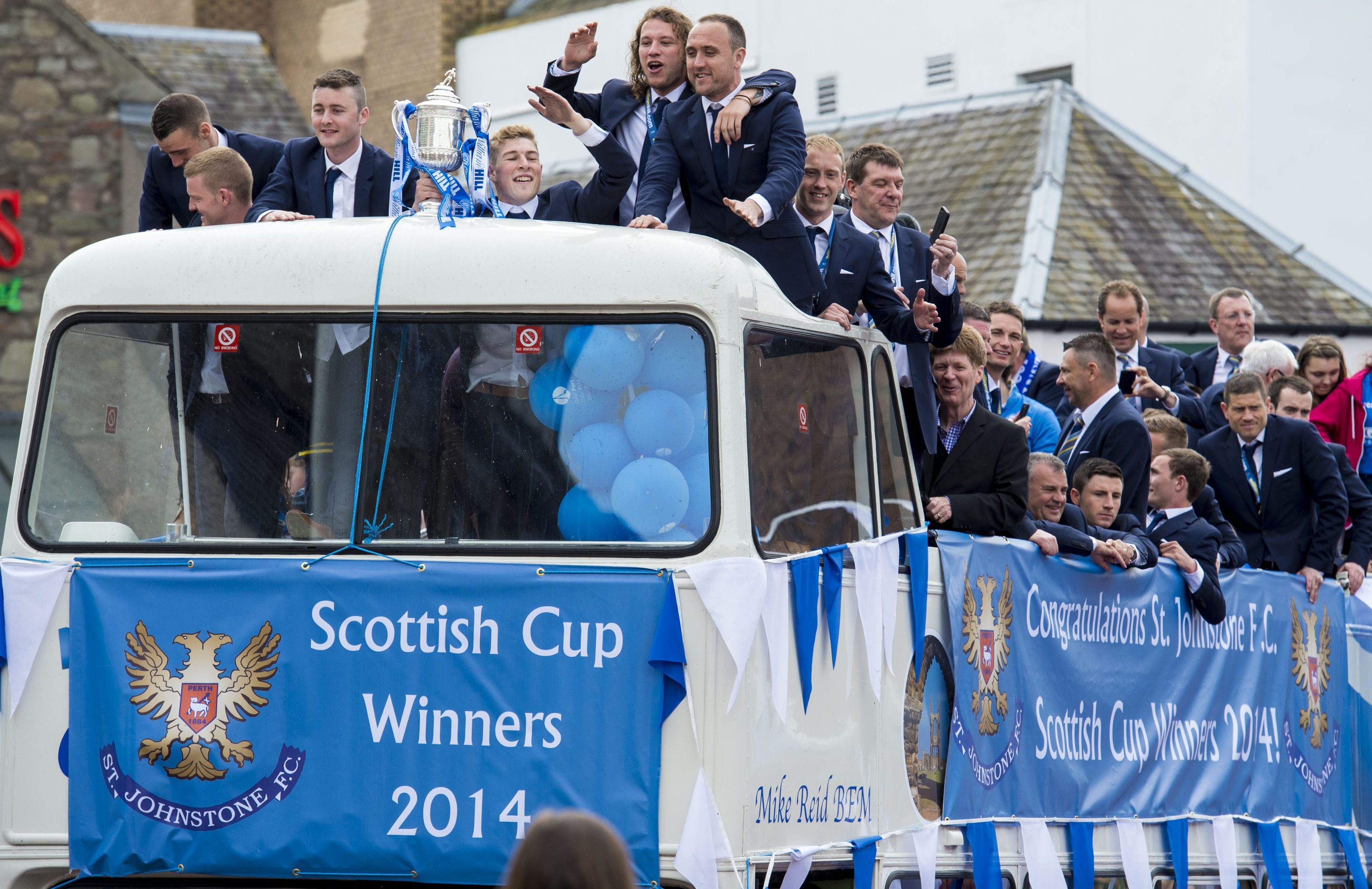 Jim can be spotted on the St Johnstone open-top bus in 2014.