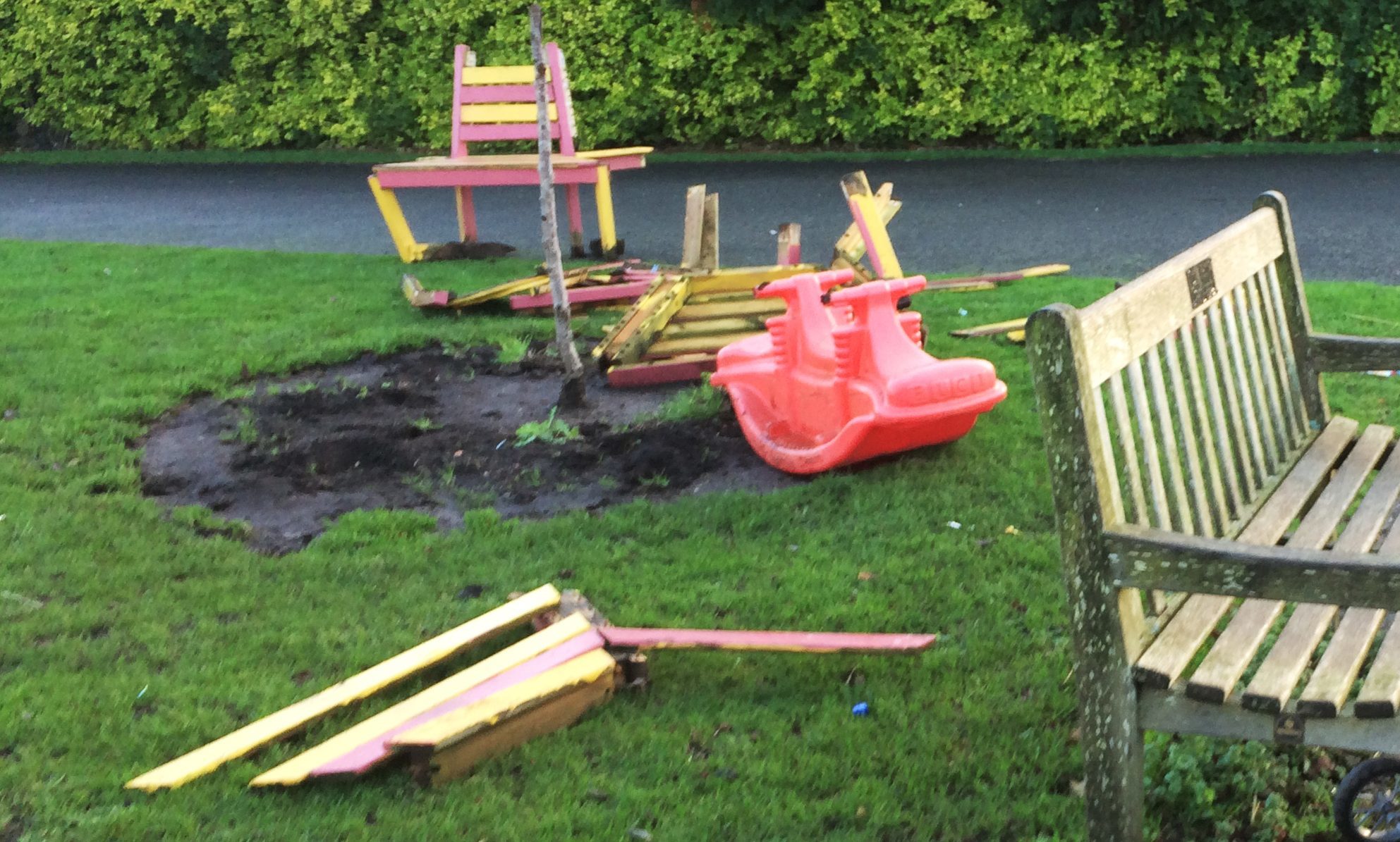 Vandals destroyed a bench, ripped out plants and left only a stalk of the tree in the garden.