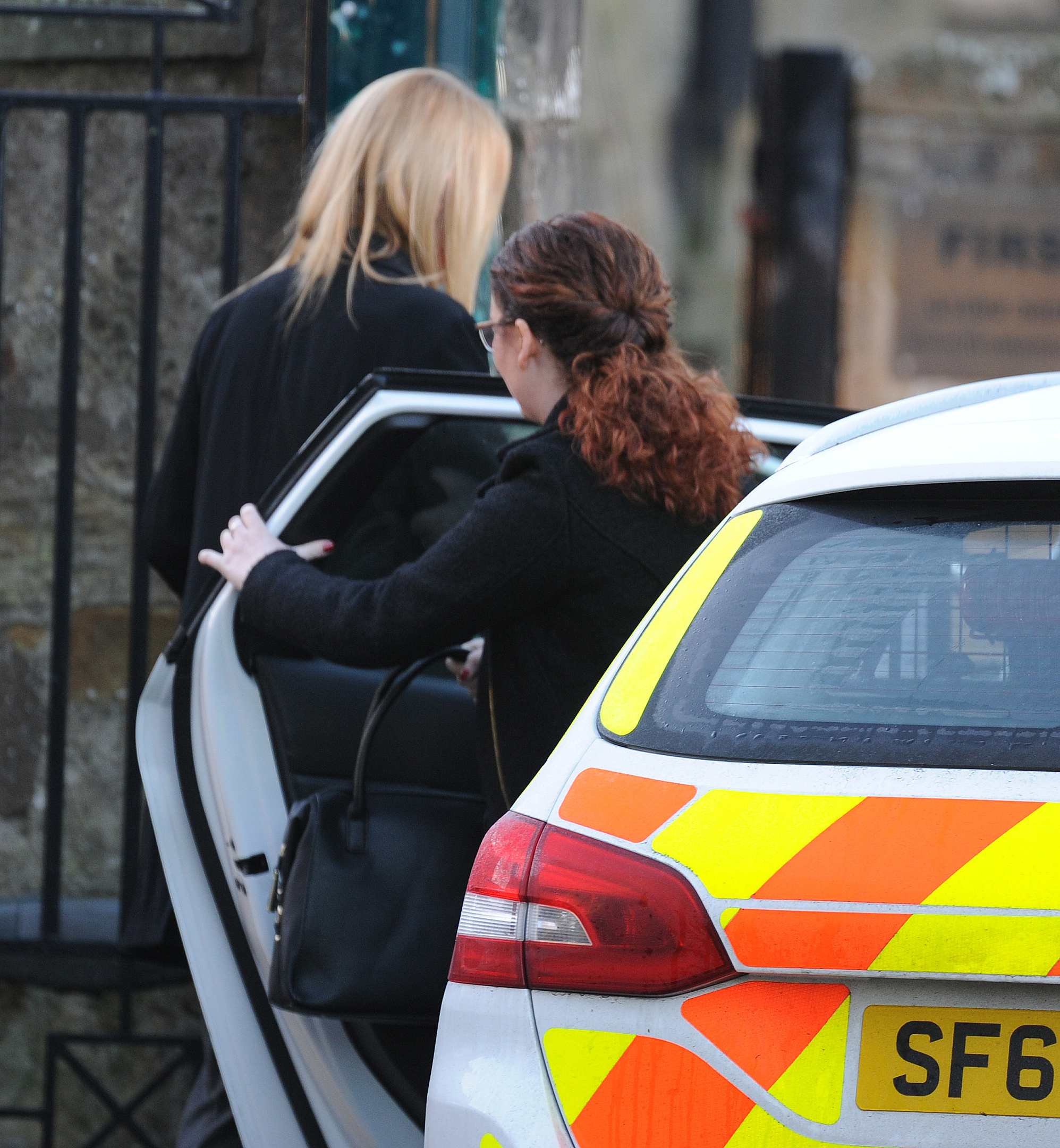 Nicole Short, seen getting out of a police car, arrives by the back door of Kirkcaldy Sheriff Court.